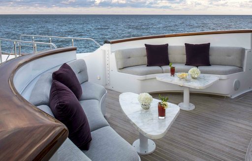 Breakfast seating arranged around the Portuguese bridge on motor yacht Carpe Diem II 