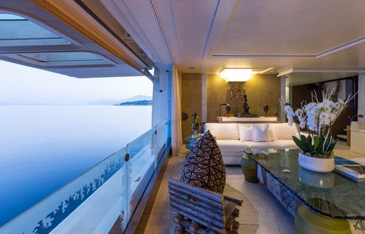 An interior section of a superyacht with a balcony door opening