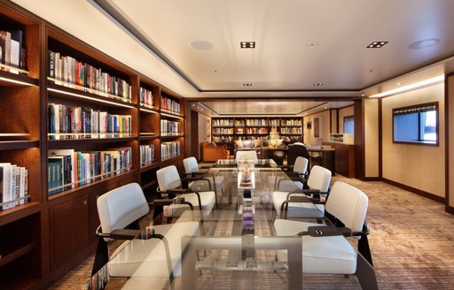 motor yacht planet nine conference room with bookshelves 