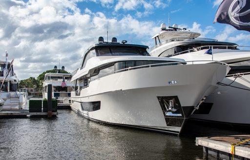 Motor yachts berthed in a marina during FLIBS