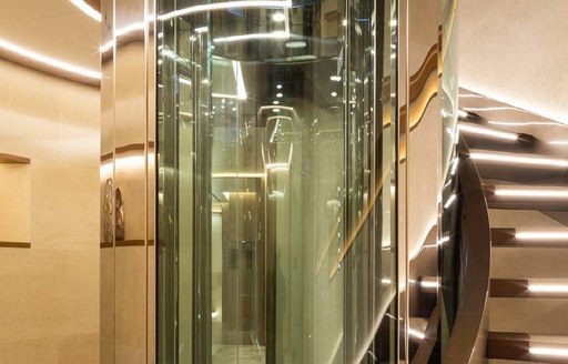 Glass elevator onboard charter yacht ALFA