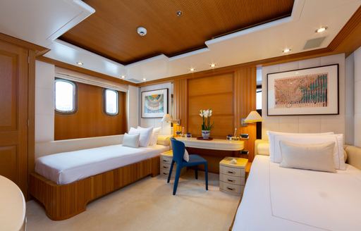 Twin berths in a cabin onboard charter yacht ADVENTURE
