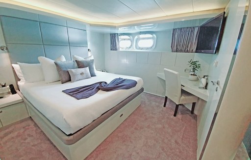 Double bed in cabin on superyacht LIONSHARE