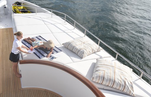 Sun pad lounging area aboard luxury yacht REBEL