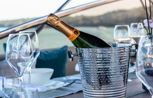 Champagne in an ice bucket onboard charter yacht CHESS