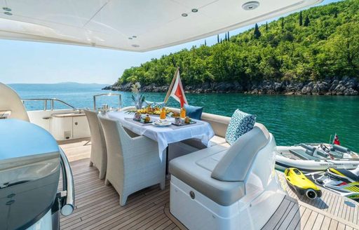 Alfresco dining setup onboard charter yacht LARIMAR II