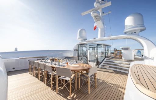Alfresco dining table on the sun deck of charter yacht CARINTHIA VII