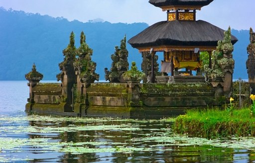 An ancient Buddhist Temple built on a lake in Bali, Indonesia