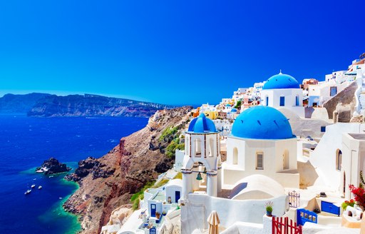 Stunning town of Oia in Santorini overlooking blue waters