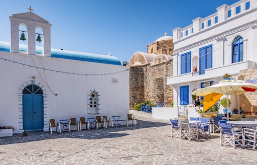 A small village square with a church in Chorio, Kimolos