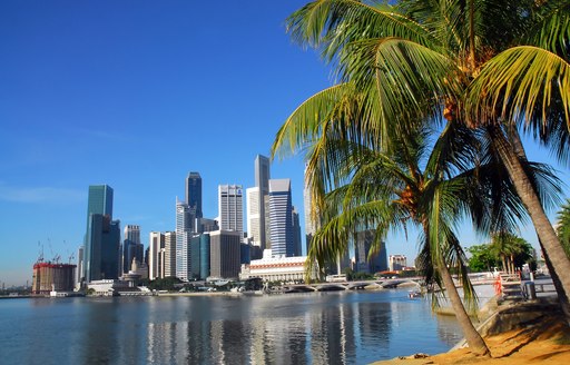 high rise buildings look over waters in Singapore