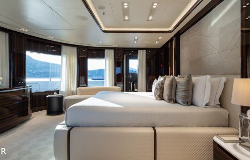 Master cabin onboard charter yacht LADY A, central berth facing panoramic windows