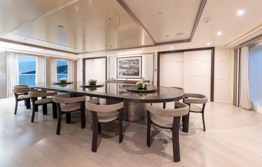 Charter yacht LUNA dining area with long table