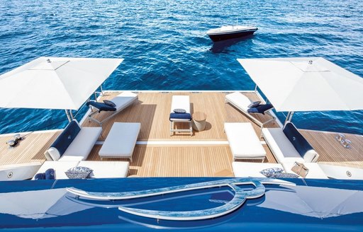 view over swim platform and parasols on board superyacht lady jorgia