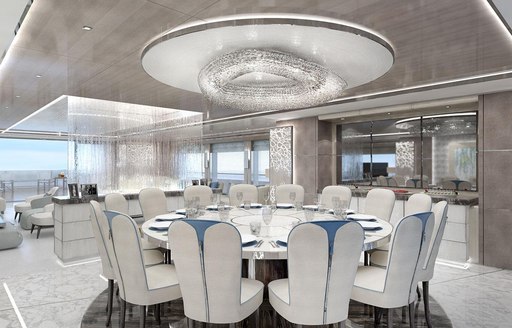 circular dining table in the main salon of superyacht GO 