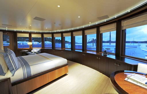 Panoramic windows in master suite in charter yacht TV