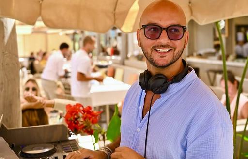 Byblos Beach DJ spinning decks