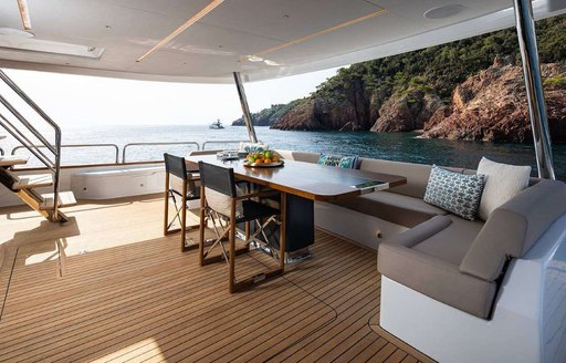 aft deck dining set up on superyacht moana ii 