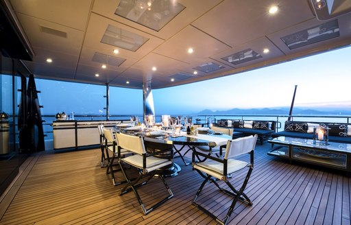 alfresco dining area on the upper deck aft of luxury yacht elixir