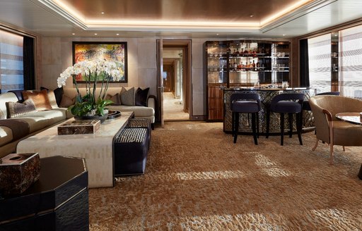 winter garden on luxury motor yacht joy, with decadent furnishings and bar 