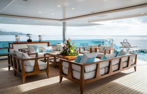 Exterior seating arrangement and sea view onboard charter yacht AXIOMA
