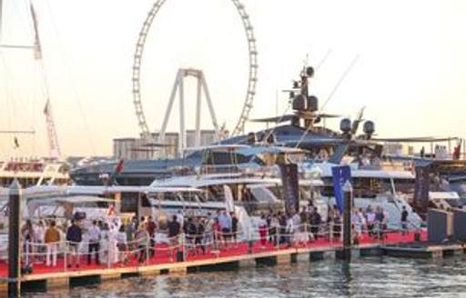 Crowds walking on red carpet at the Dubai International Boat Show