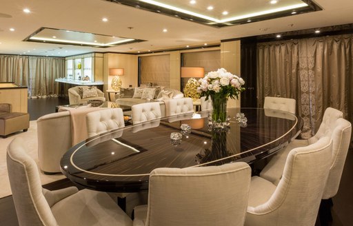 lacquered dining table with lounge beyond on board luxury yacht ELIXIR 