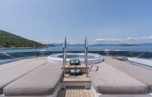 Charter yacht BLISS sun pads and deck Jacuzzi