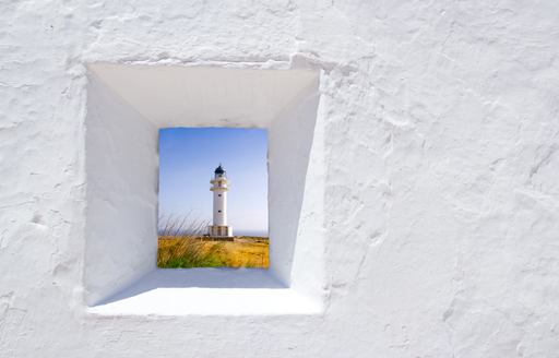 White plaster wall with lighthouse visible