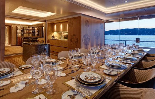 table is set for dinner in the winter garden aboard motor yacht JOY 