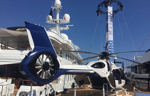 support vessel New Frontiers with helicopter on deck at the Monaco Yacht Show 2017