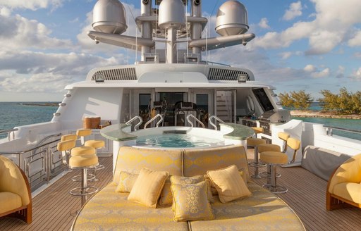 sunpads and Jacuzzi with swim-up bar on the sundeck of luxury yacht My Seanna