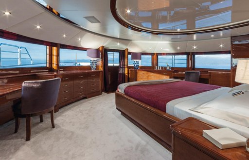 sleeping area with panoramic views in the master suite aboard luxury yacht CHECKMATE 