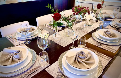 Close up of laid dining table on superyacht LIONSHARE