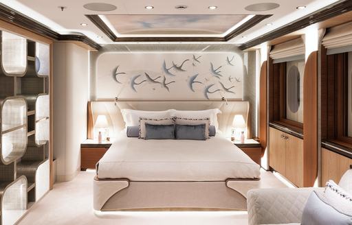 Guest cabin onboard charter yacht AHPO, central berth facing forward with windows to starboard