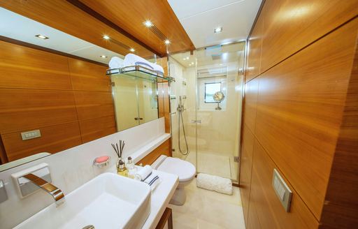 Ensuite facility for a guest cabin with sunk unit and shower cubicle onboard luxury yacht charter REHAB