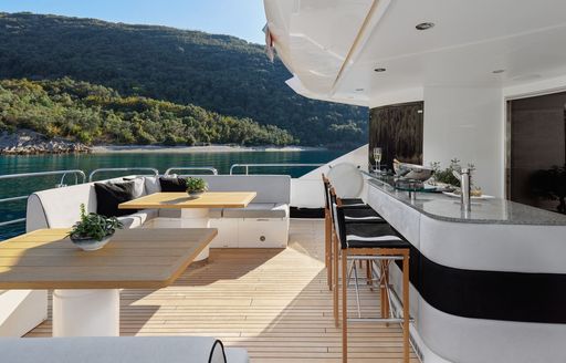 Charter yacht WICKED PLAY exteriors with wet bar and seating