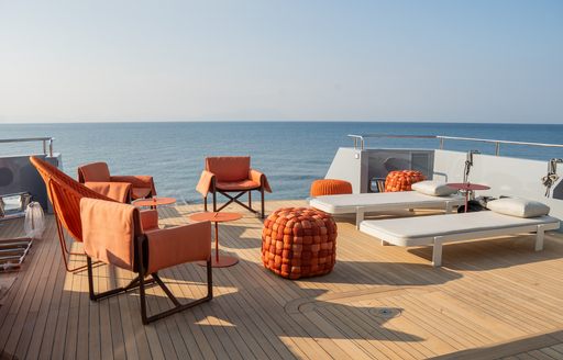 Exteriors with orange furnishings onboard charter yacht CARMEN