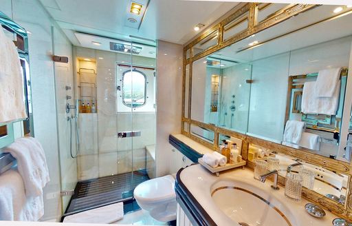 Ensuite facility with sink unit and separate shower cubicle onboard superyacht charter AFTER YOU