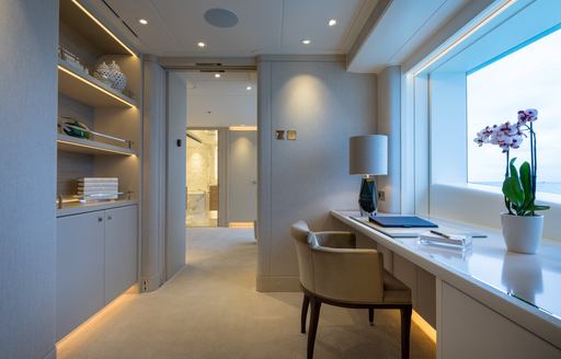 Private study with large window onboard luxury yacht rental SANTOSHA