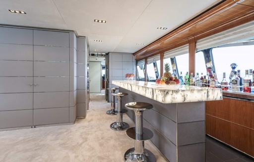 Charter yacht BLISS interior wet bar with stools