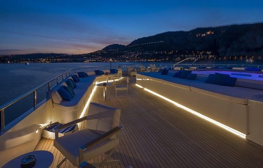 sundeck aboard luxury yacht SERENITY lights up at night