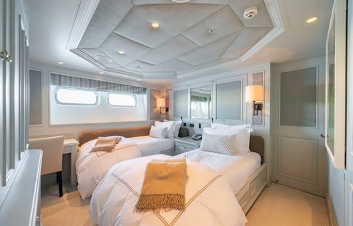 Twin guest cabin with two single berths onboard charter yacht MOSAIQUE