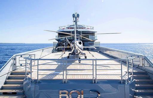 Helicopter on helipad onboard charter yacht BOLD