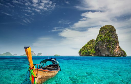 Railay Beach with fishermen's boat and blue seas