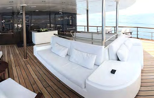 Large comfortable white sofa on Superyacht CHAKRA