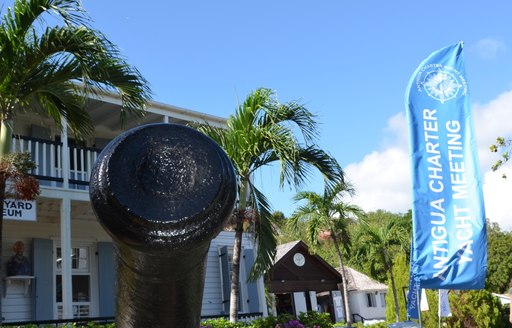 cannon and Antigua Charter Yacht Show flag in the historic English Harbour, Antigua