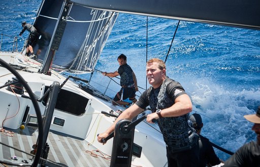 Sailors on deck of sailing yacht during Les Voiles de Saint Barth