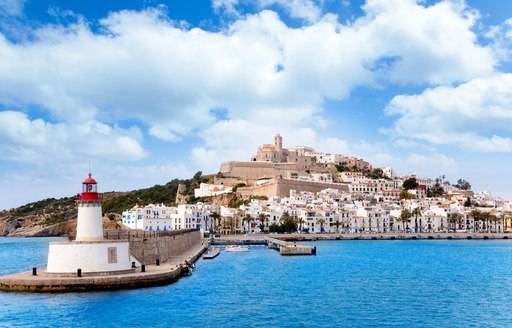 the charming Ibiza Town seen from the azure waters