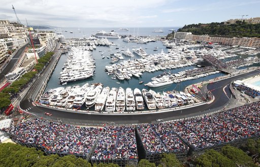 The section of the Monaco Grand Prix track with yachts lining it